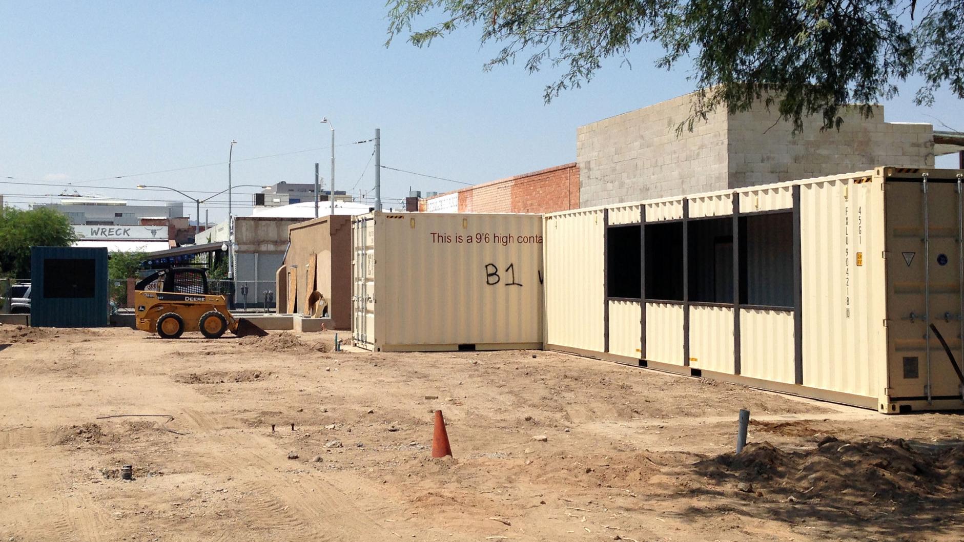 Boxcars that will house dining, entertainment space arrive on Fourth Avenue